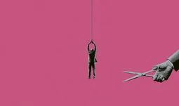 a man dangling from a rope that's about to be cut