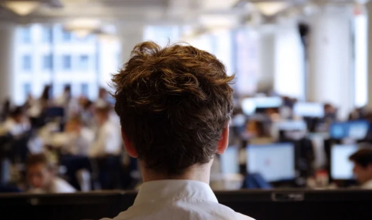 a banking intern seen from behind 