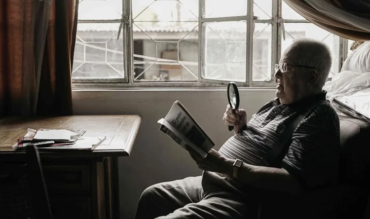a man with a magnifying glass