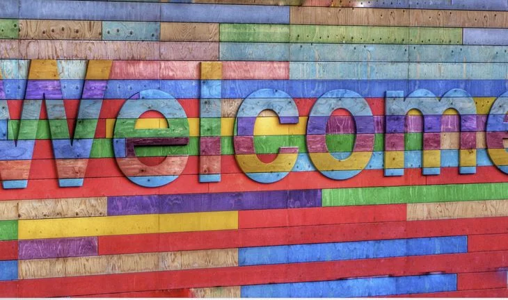 rainbow sign that says welcome