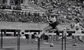 woman jumping a hurdle 