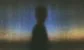 silhouette of a man against a blueish background
